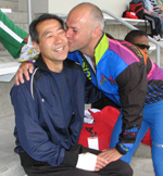 Dean Koga,left, being kissed by Giampiero Mancinelli