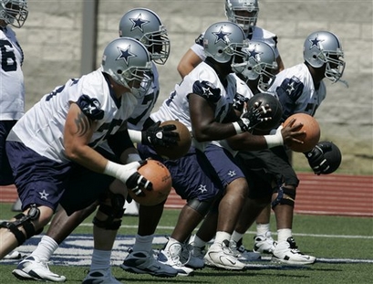 Cowboys-offensive-line-look-to-work-out-on-some-drills-using-training-equipment-during-their-minicamp_medium